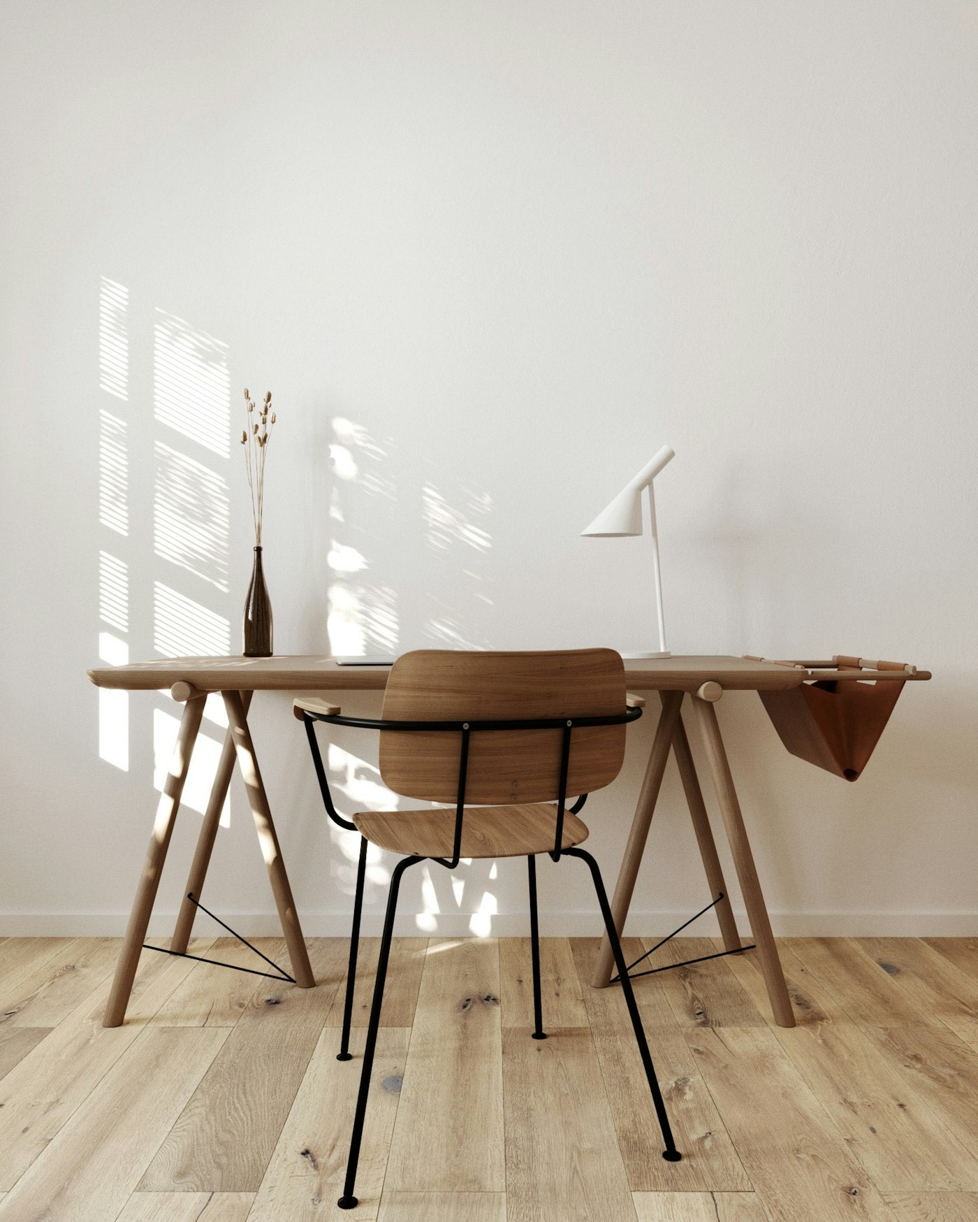 Timber desk and chair in raking afternoon light