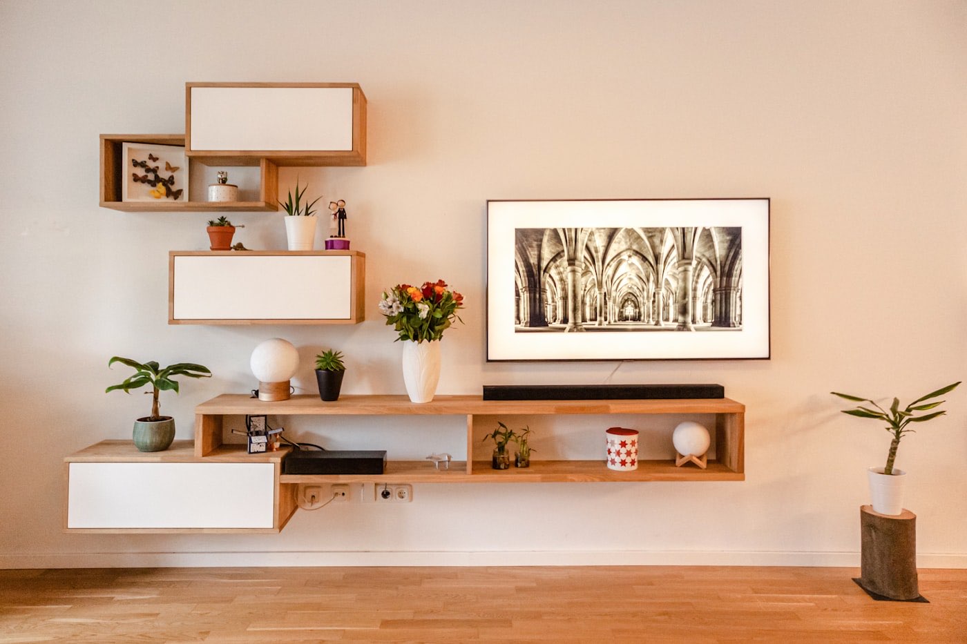 Built-in timber shelving detail against a warm plaster wall