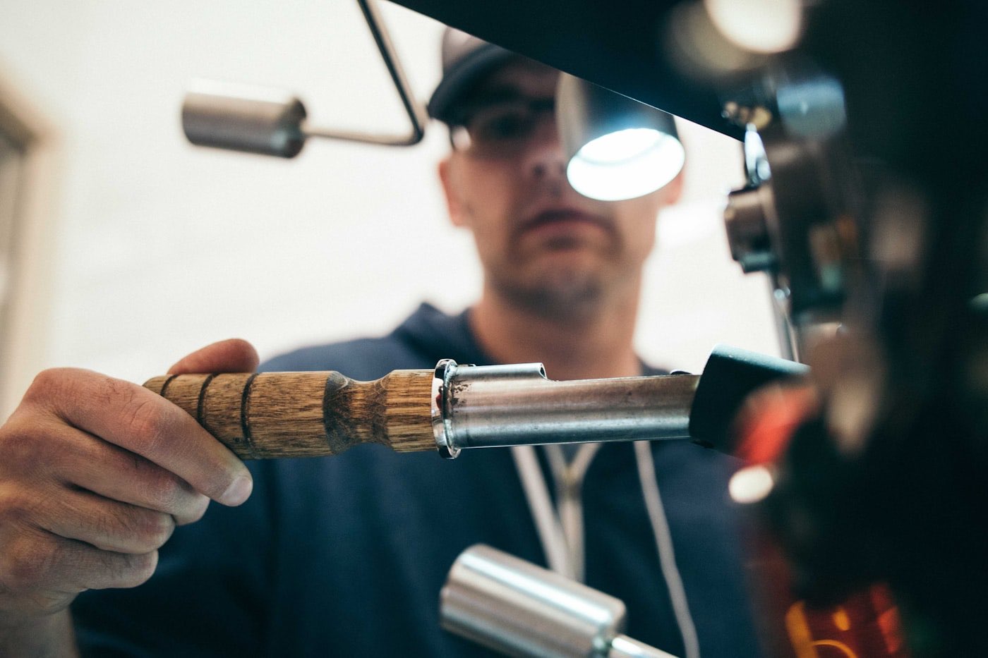 Maker turning a timber component at the lathe