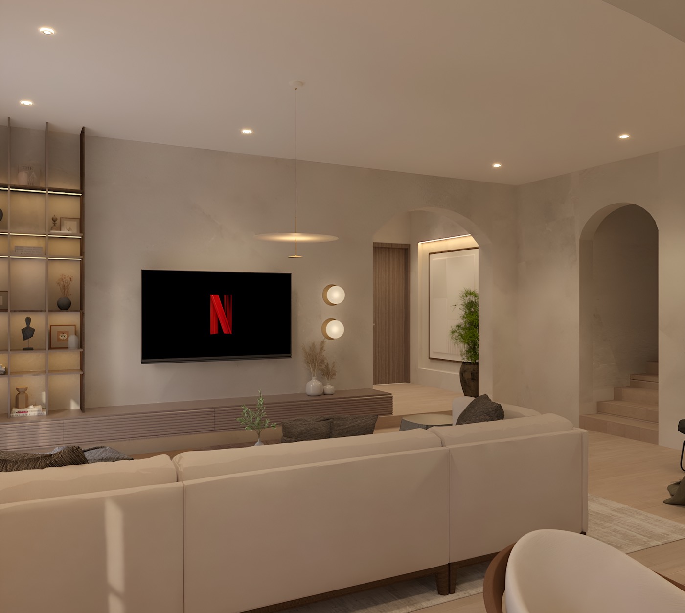 Seating turned to the television, the arched recess lit from within